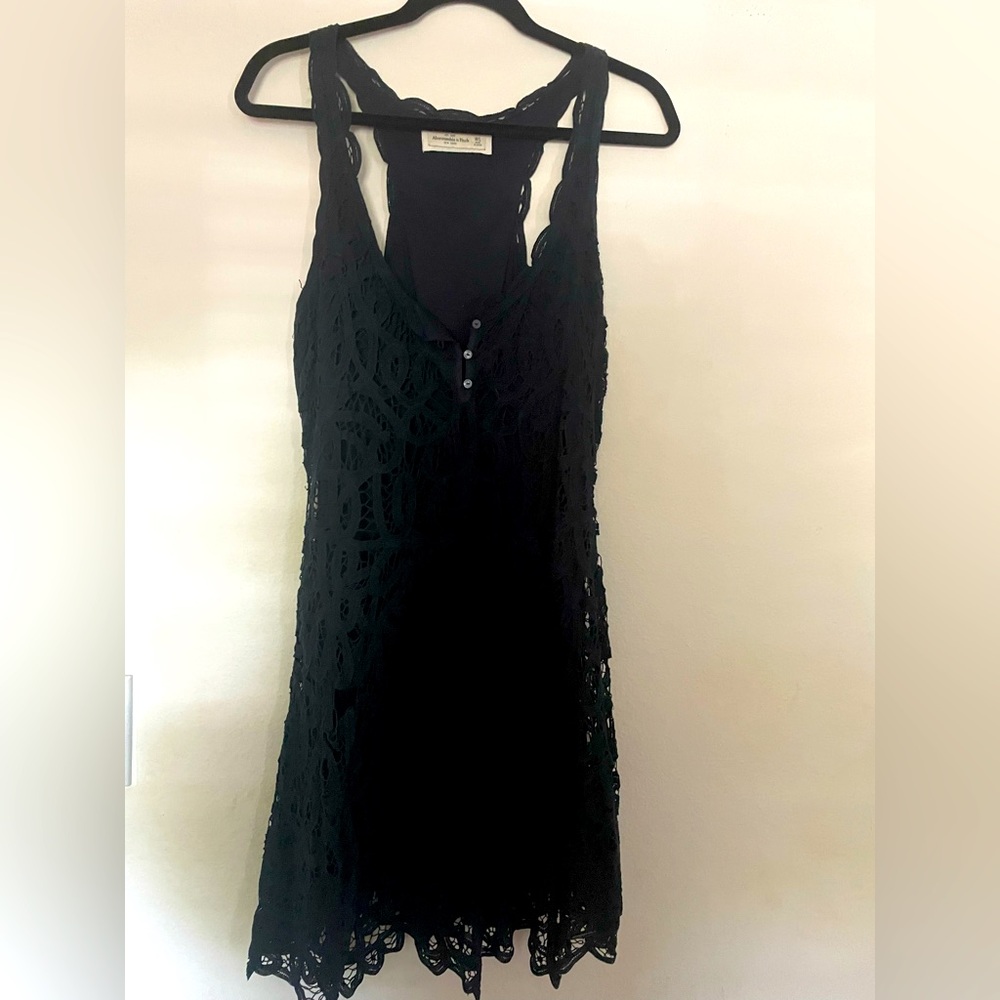 Pretty detailed navy blue crochet dress.